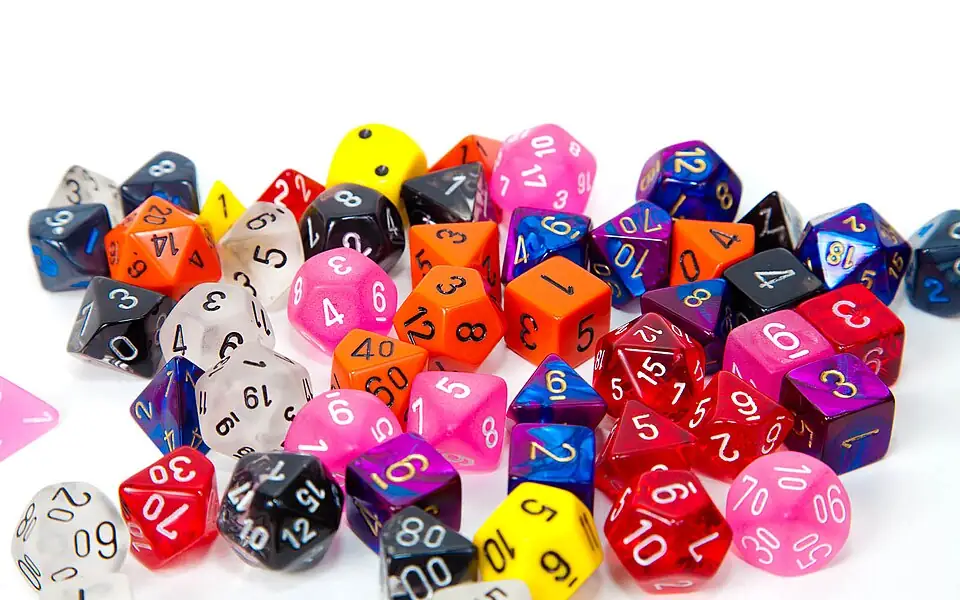 Pile of colorful red, blue, yellow, pink and orange gaming dice